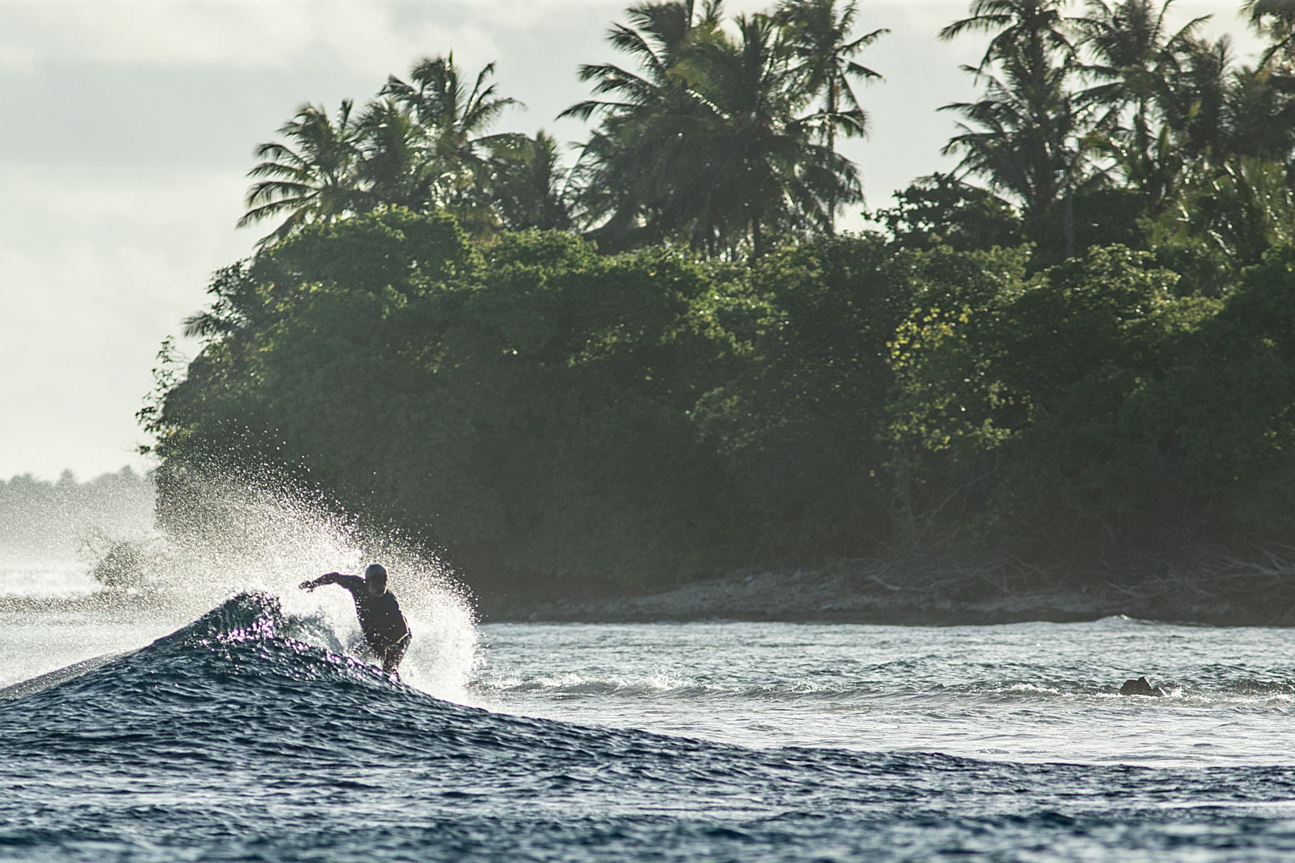 Calm ocean surface at a Maldives surf spot showing ideal wind and swell conditions