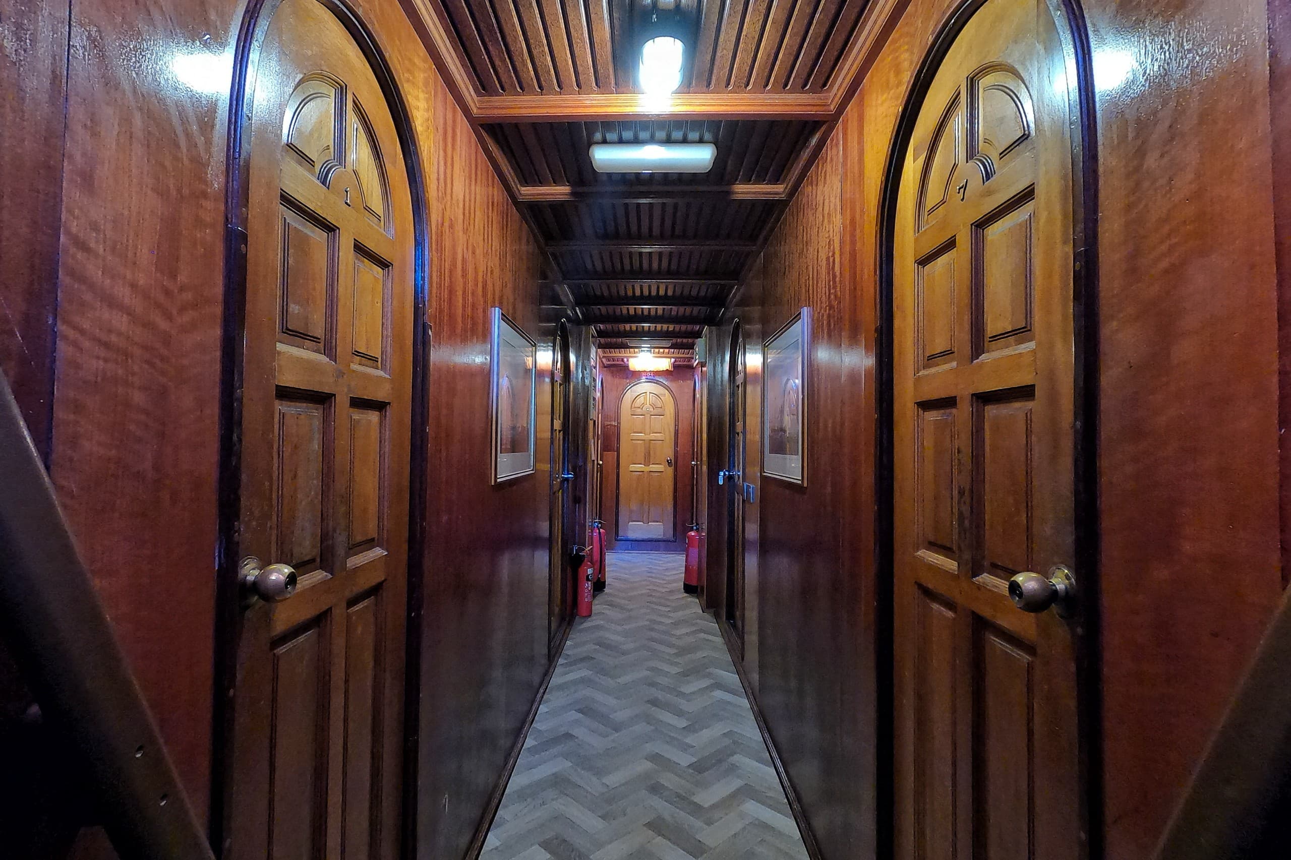 Cabin corridor on Maavahi surf charter showing access to guest rooms