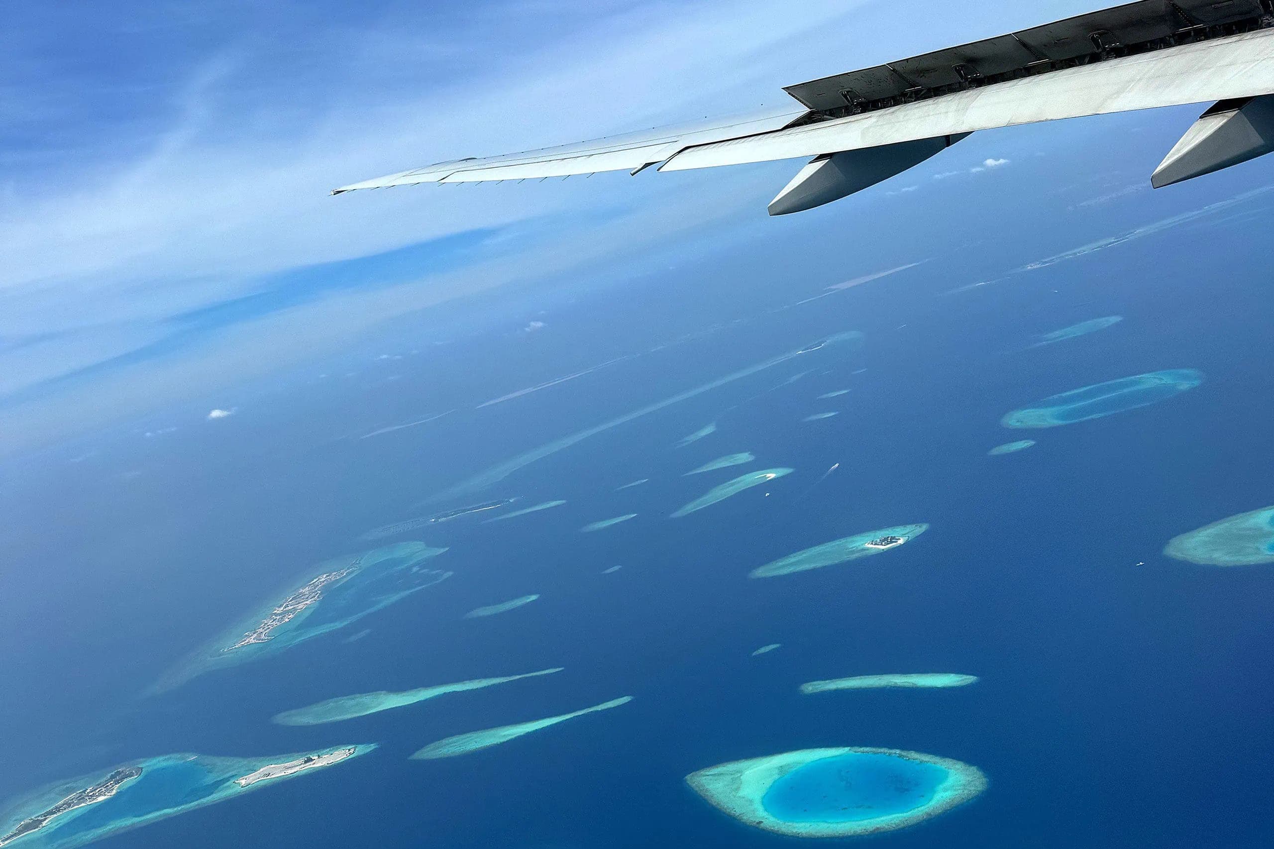 Aerial view of Maldives atolls upon arrival