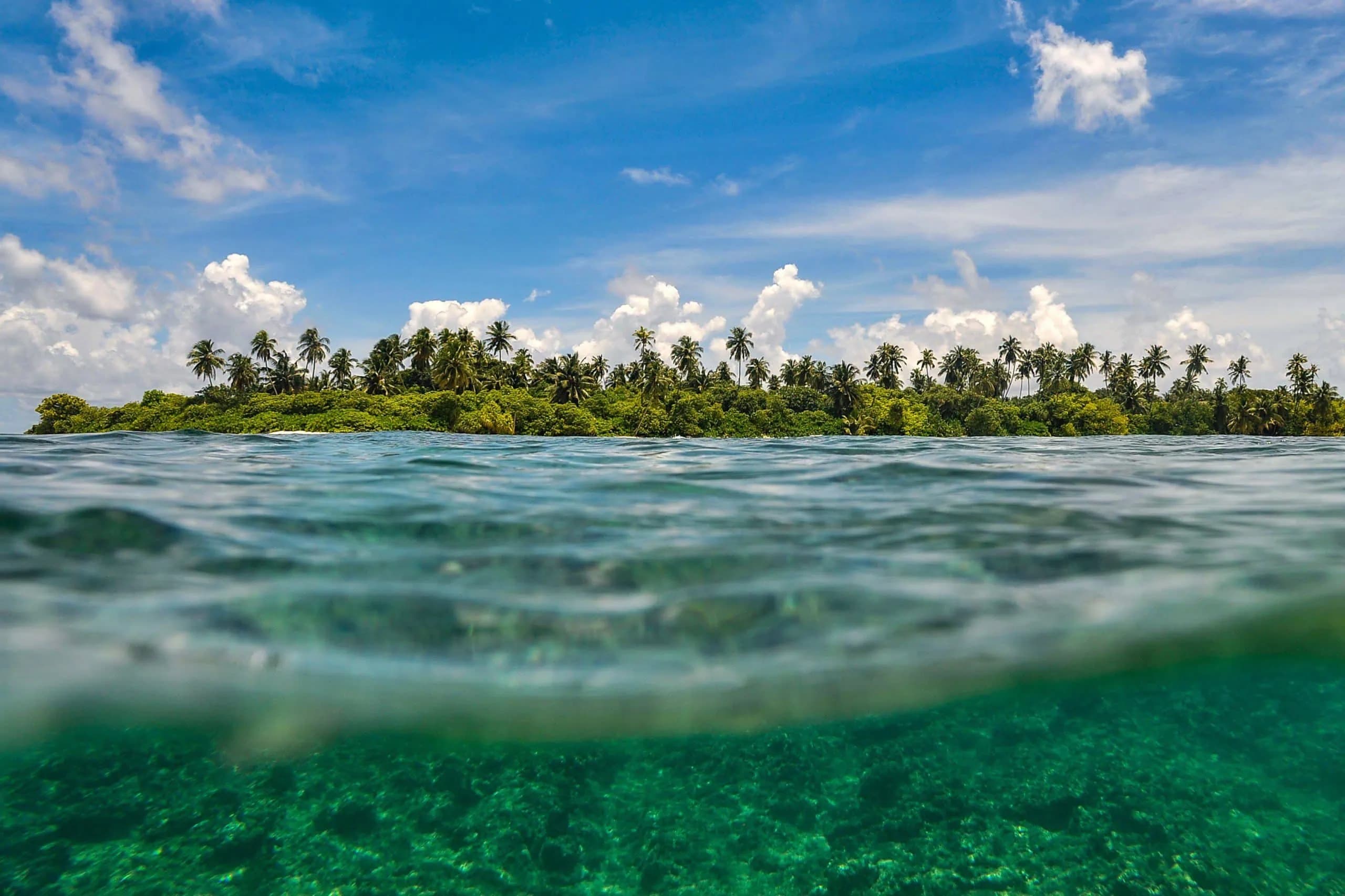 Waterline view of a reef and island in the Maldives
